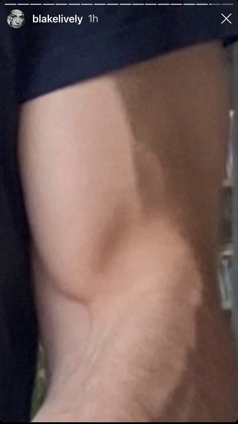 A zoomed-in version of the cake photo, zoomed in on Ryan&#x27;s muscular bicep holding the cake