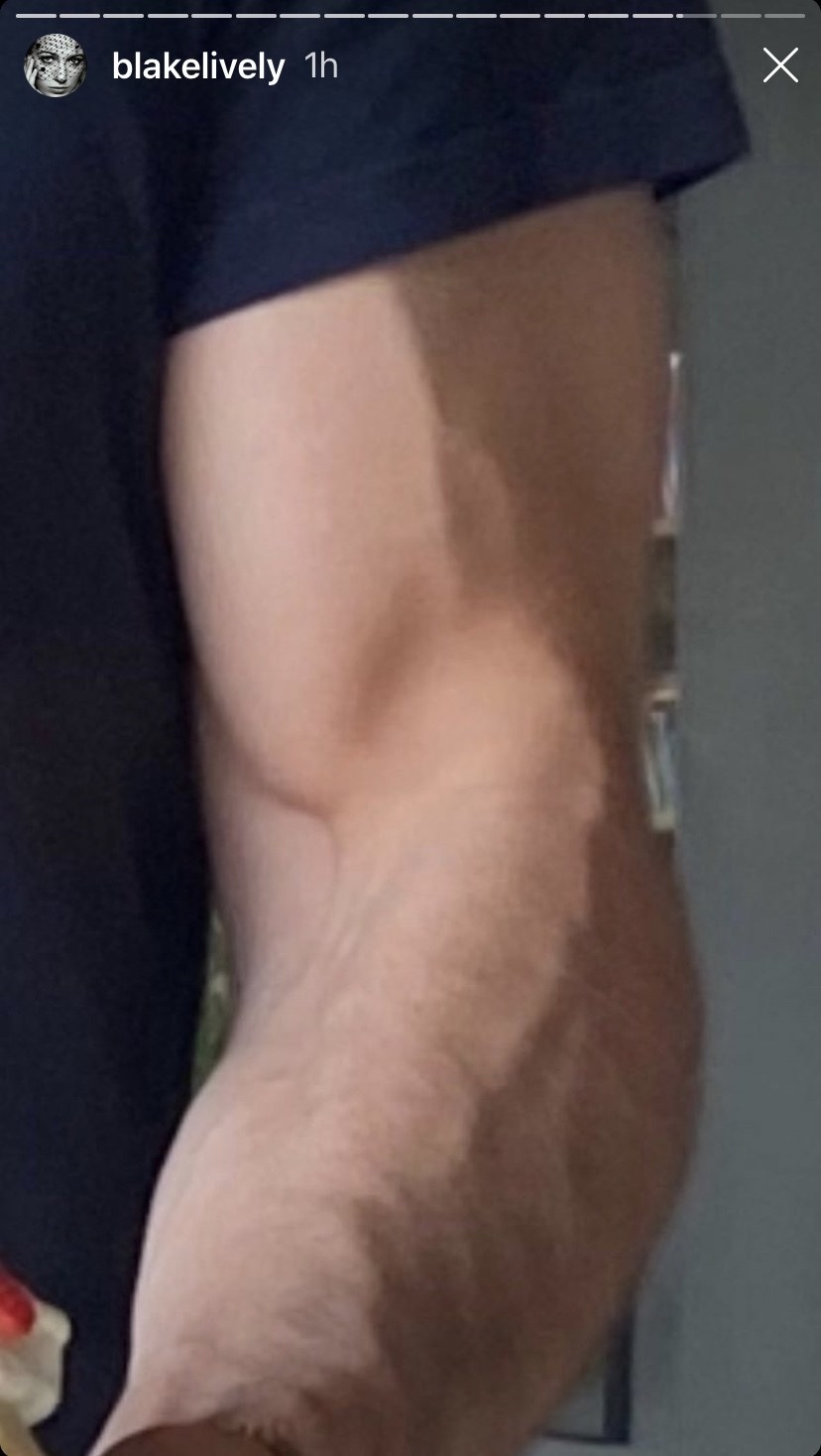 A zoomed-in version of the cake photo, zoomed in on Ryan&#x27;s muscular bicep holding the cake