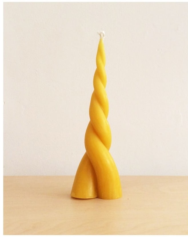 twist candle in yellow that looks like unicorn horn
