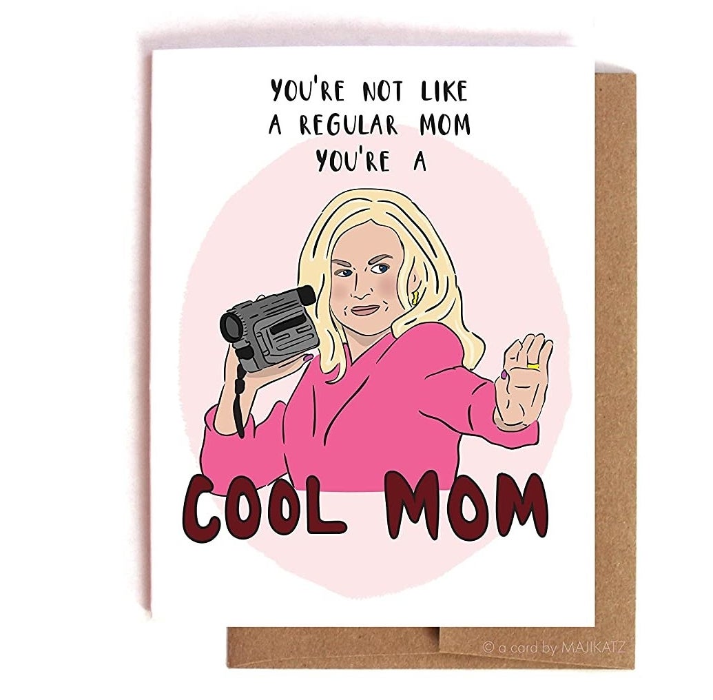 A greeting card with Mean Girls character Mrs. George holding a camcorder with a caption that says You&#x27;re not like a regular mom you&#x27;re a cool mom