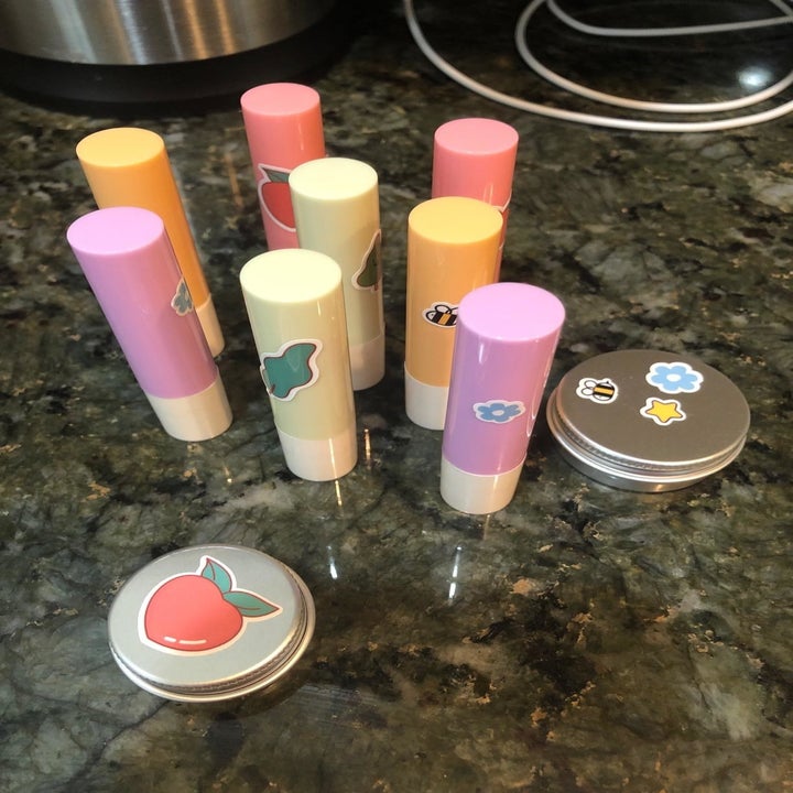reviewer's diy lip balms decorated with stickers 