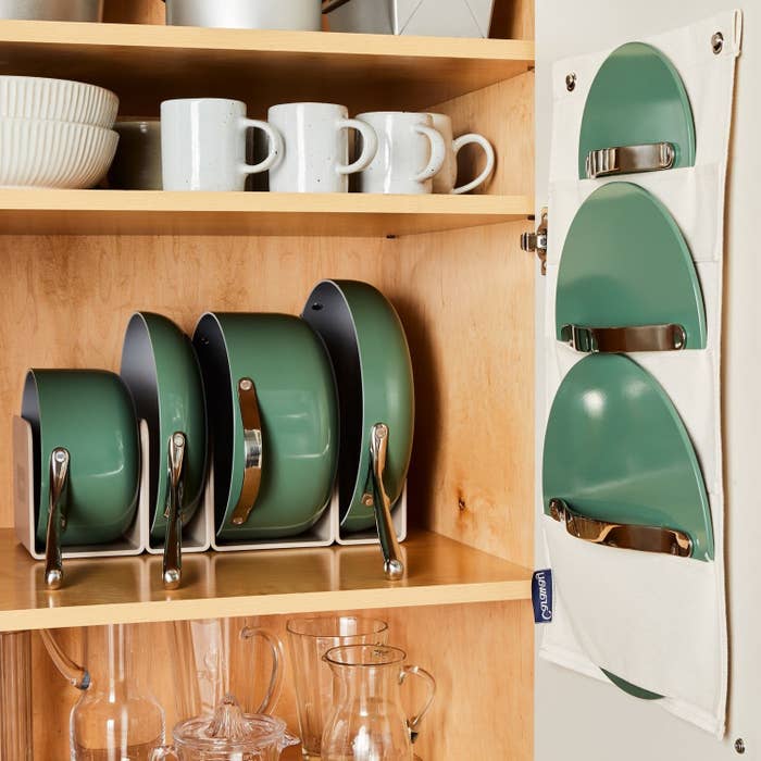 The four pants in green in the rack in a cabinet with the lid holder with the green lids in the slots hanging on the door