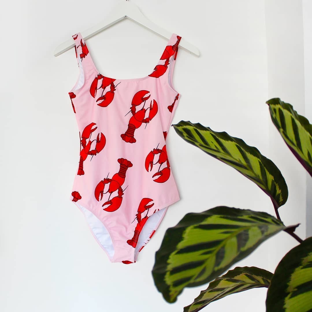 pink swimsuit with red lobster illustrations 