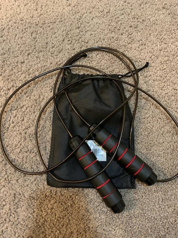 A reviewer showing the jumprope with a carrying bag