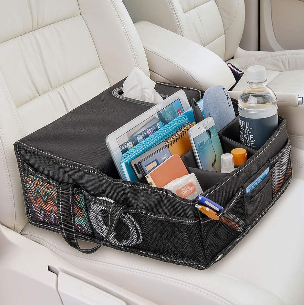 A front seat organizer with different compartments for small things like phones, bottles, and glasses