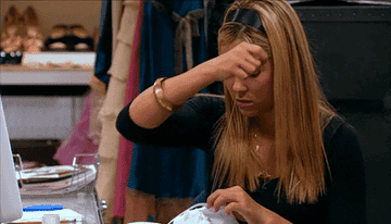 A GIF of a person sewing a garment