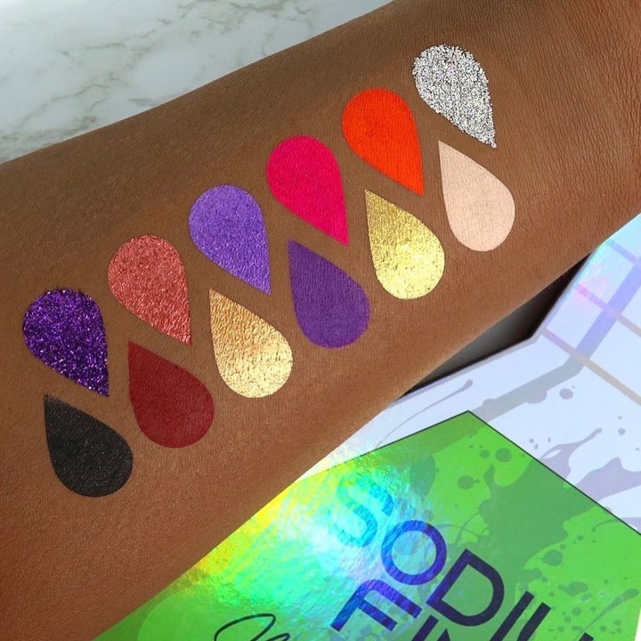 teardrop-shaped swatches of all 12 shades in the eyeshadow palette