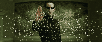 Neo stopping dozens of bullets mid-air.