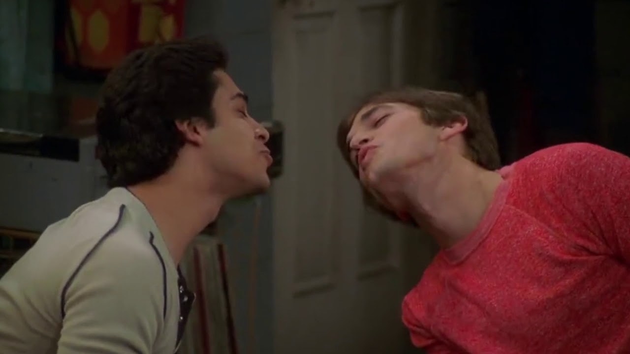 Kelso and Fez make kissing faces at each other