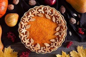 An autumn pie with leaves surrounding the edges