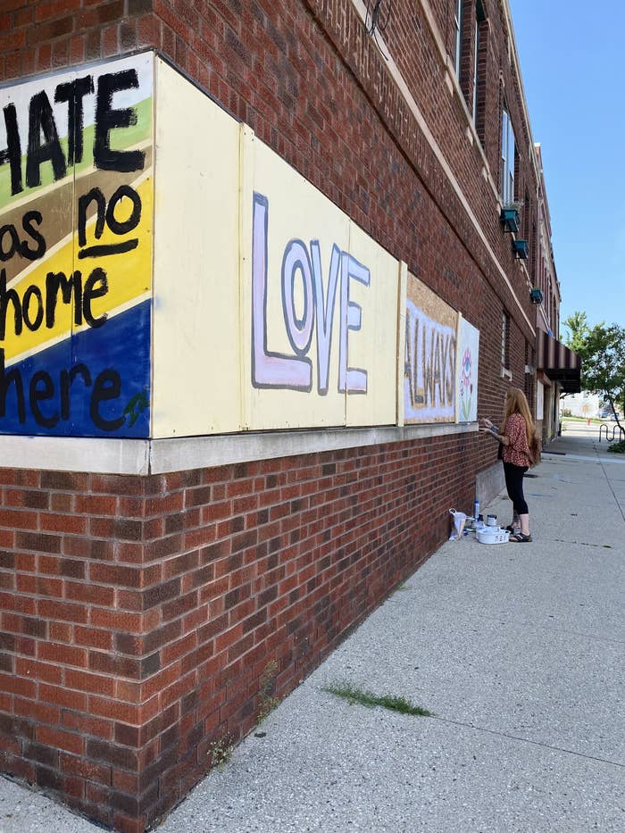 Murals say "hate has no home here" and "Love"