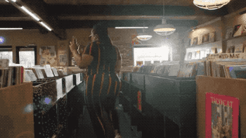 A &quot;High Fidelity&quot; GIF of Da&#x27;Vine Joy Randolph as Cherise dancing in the record store