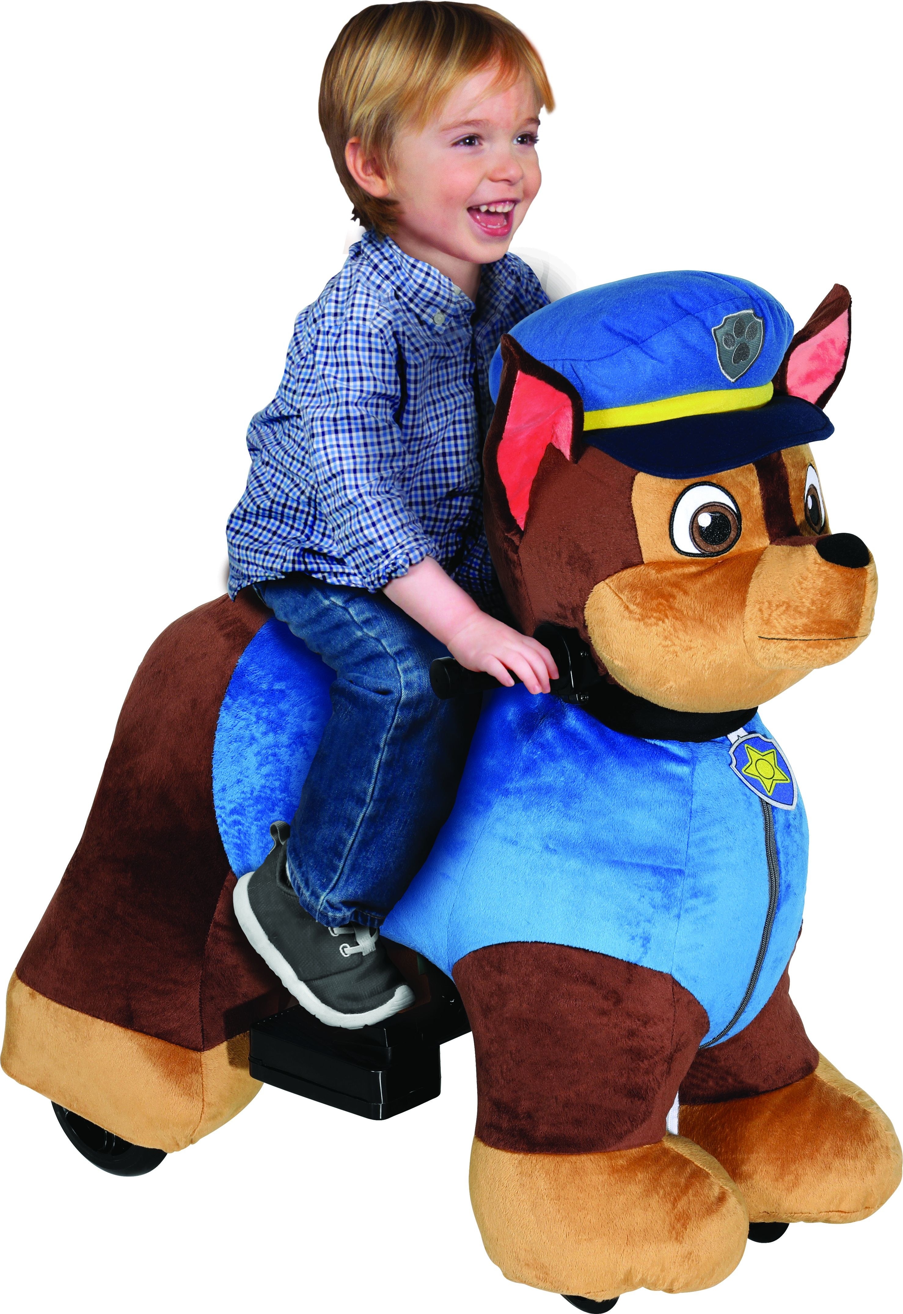 child riding a paw patrol toy