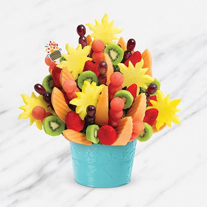 A fruit bouquet with tons of fruits in different shapes of flowers