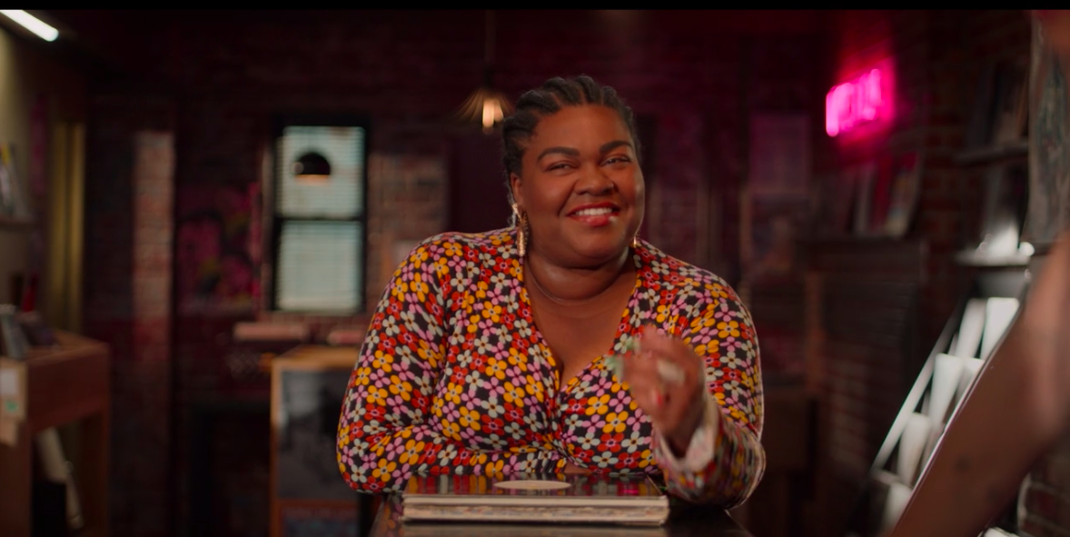 A &quot;High Fidelity&quot; still of Da&#x27;Vine Joy Randolph wearing a pattern dress while smiling