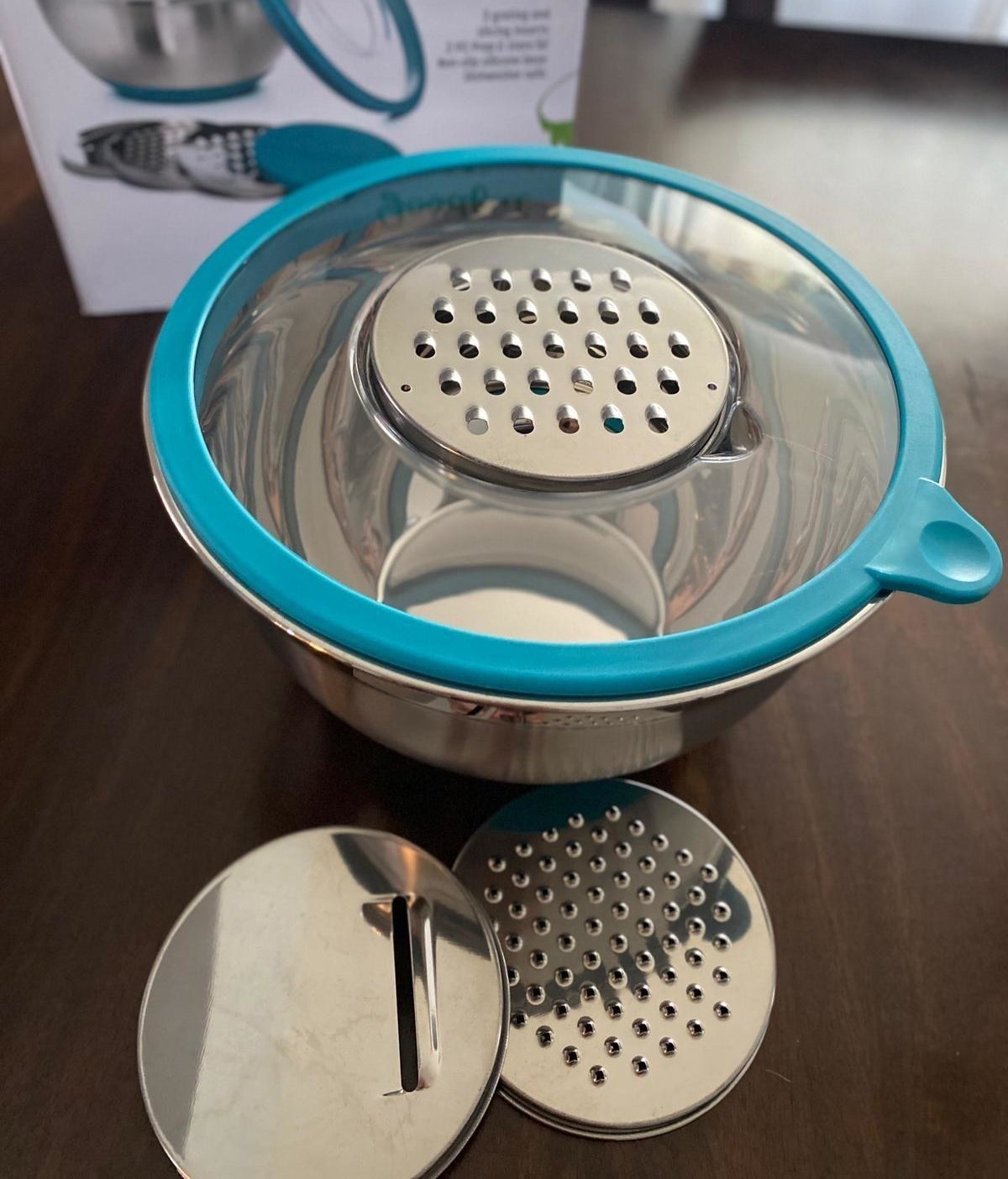 reviewer&#x27;s set with the grater insert  placed in the clear lid