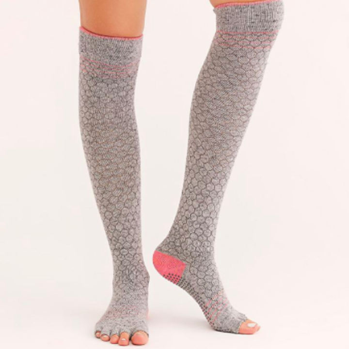 A standing person wearing the grip socks