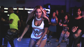 Beyonce dances as she rollerskates in a roller rink, as from the music video for her song, &quot;Blow&quot;