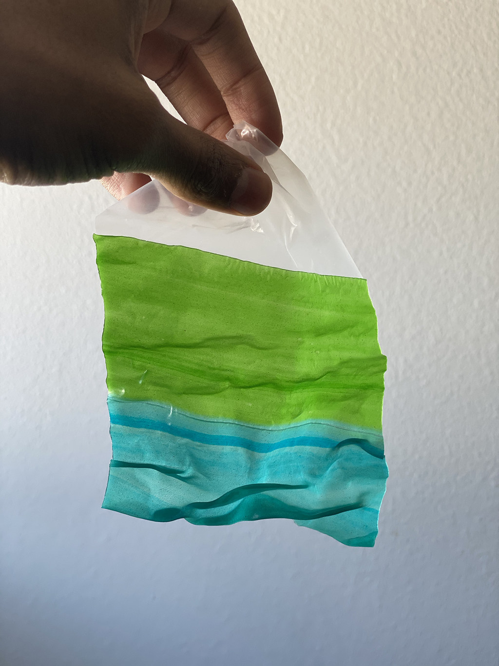 An unwrapped, green and blue Fruit Roll-Up