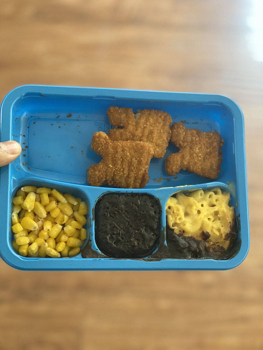 A tray of chicken nuggets, corn, mac and cheese, and a brownie