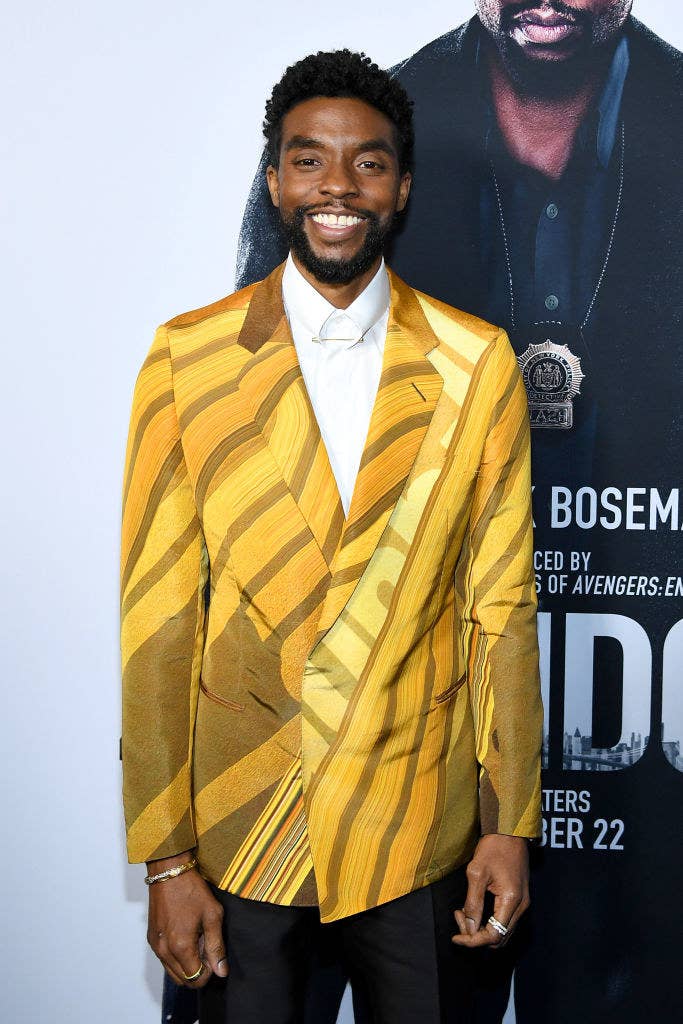 Chadwick Boseman poses at a Hollywood tournament