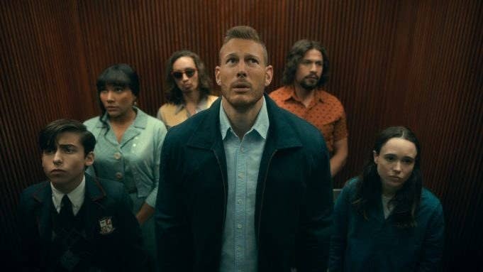 The Hargreeves' siblings standing in an elevator together