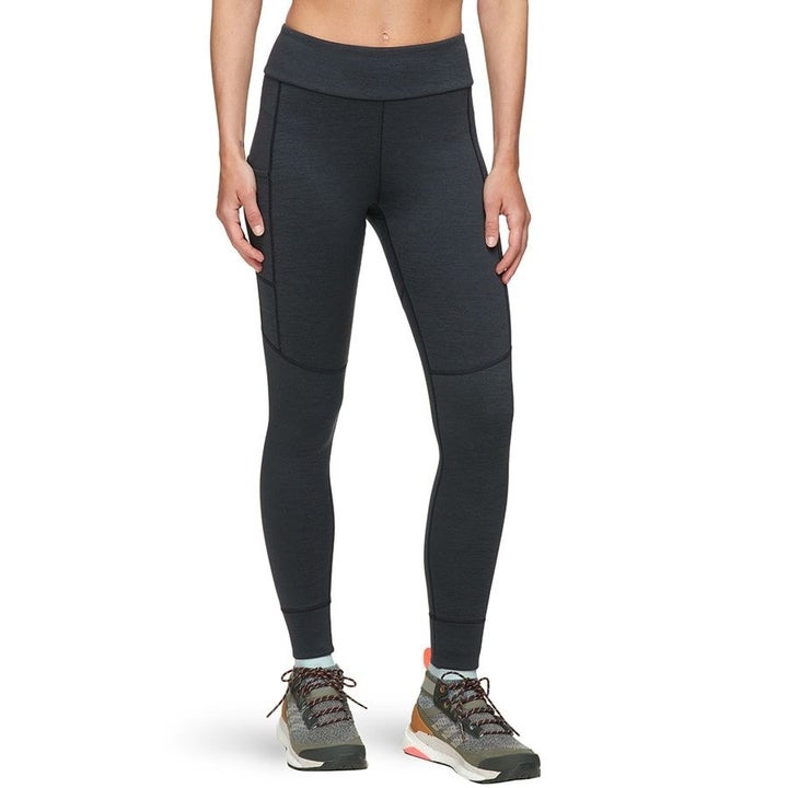 A model in black leggings 