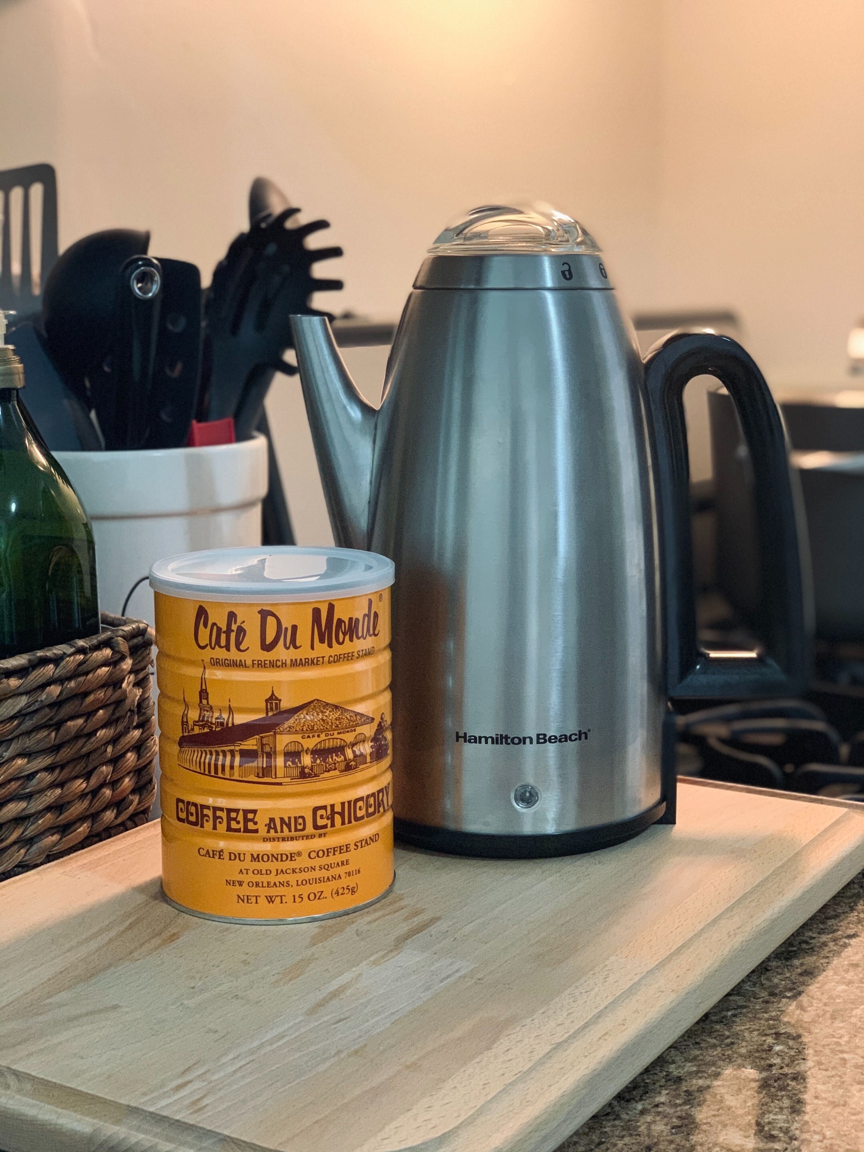 Canister of Cafe Du Monde coffee and a Hamilton Beach coffee percolator