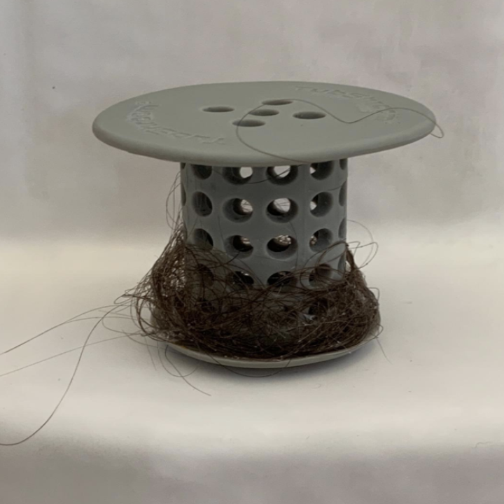 a grey tubshroom filled with hair