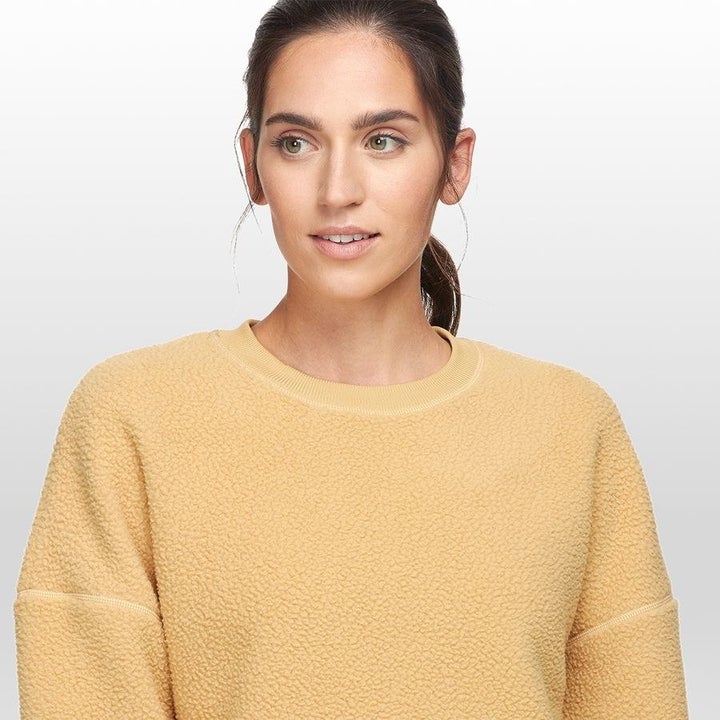 A pale yellow fleece pullover 