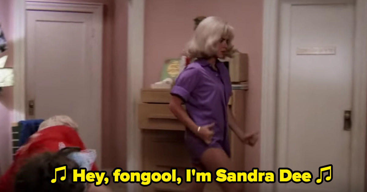 Rizzo dancing around in an oversized shirt and wig, singing &quot;Look at Me, I&#x27;m Sandra Dee&quot;