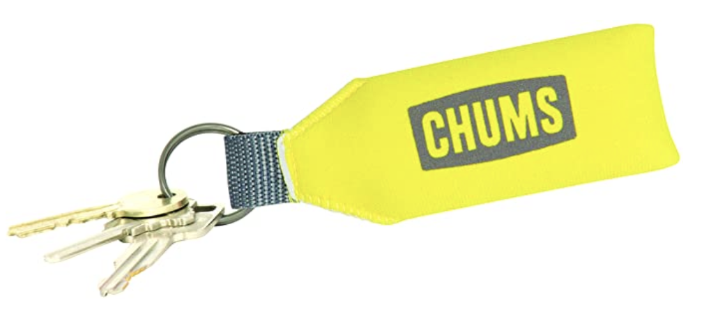 The bright yellow keychain with the word &quot;chums&quot; on it and three keys attached