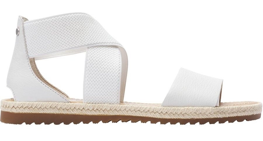 A white cross-strapped sandal with a beige sole 