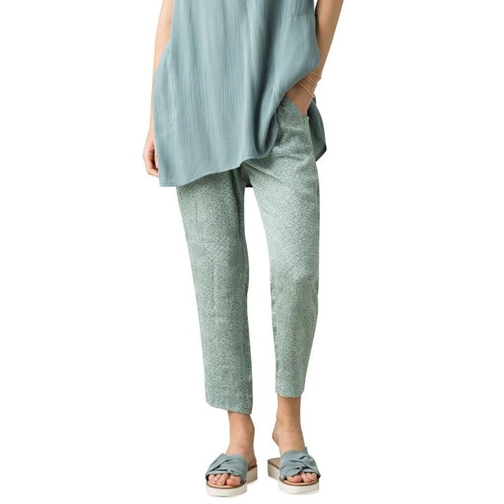 A model in seafoam green patterned pants 