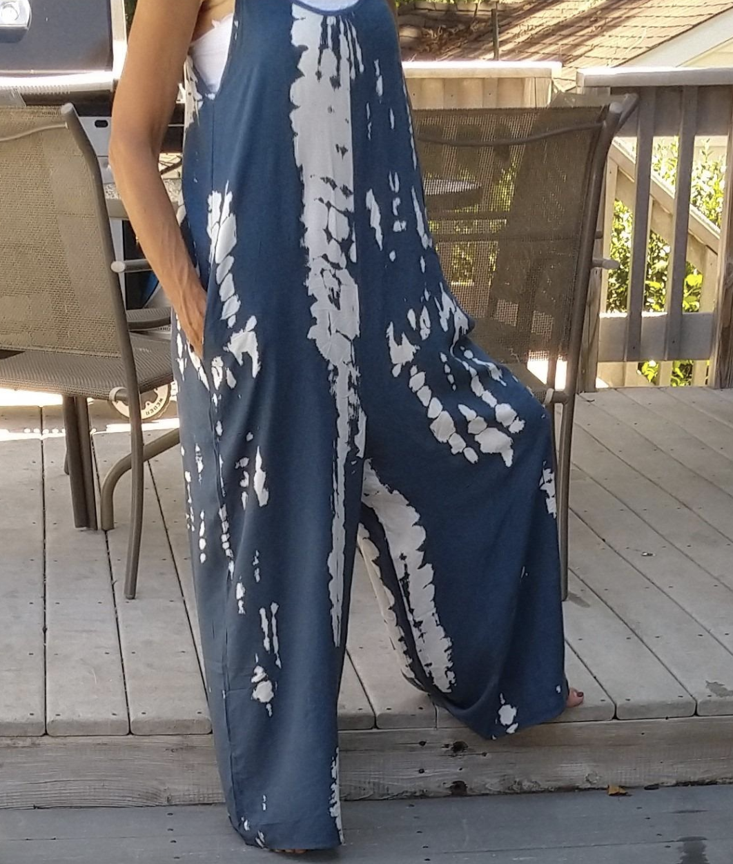 reviewer wearing white and blue tie dye jumpsuit