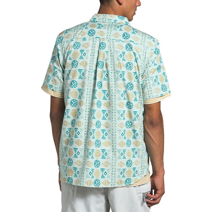 A model in a blue and green print version 