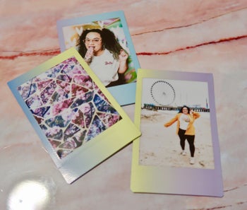 Three of Kayla's Polaroid-looking photo prints with a tie-dye border effect