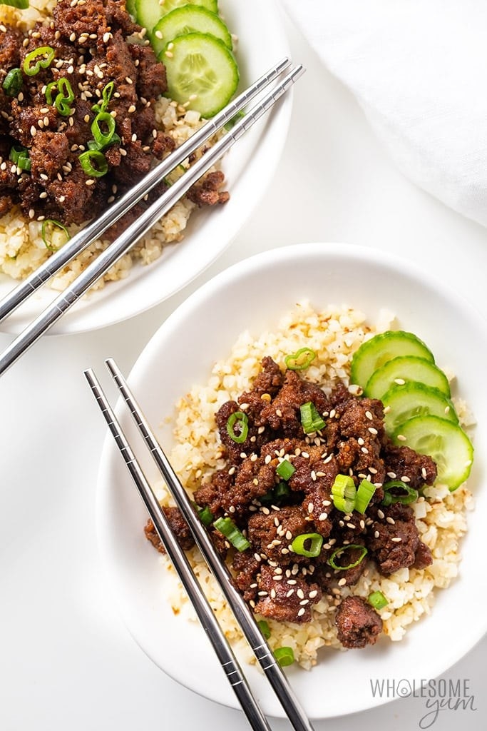 Korean ground beef bowl garnished with sesame seeds and scallions