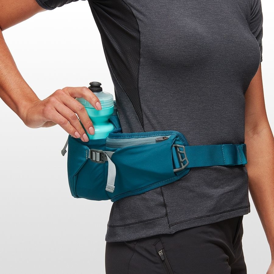 A model with a blue waist pack that fits a water bottle 