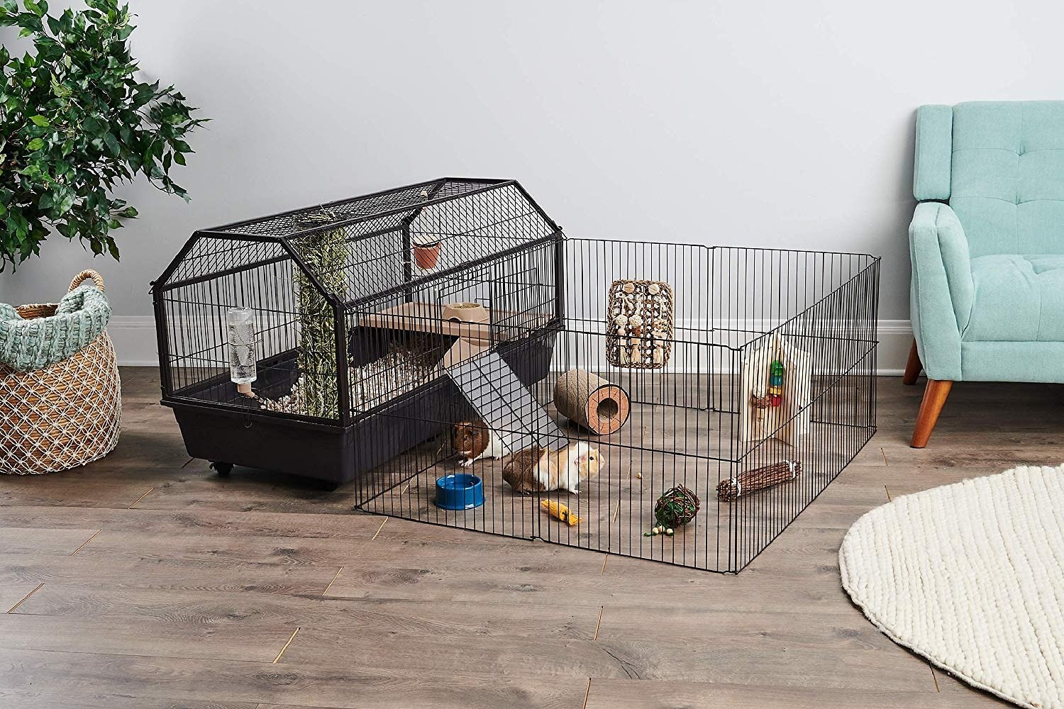 The cage with a play pen attached and a hamster inside