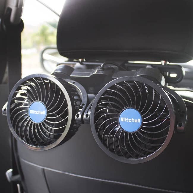 The dual fans, which wrap around the back of the headrest. 