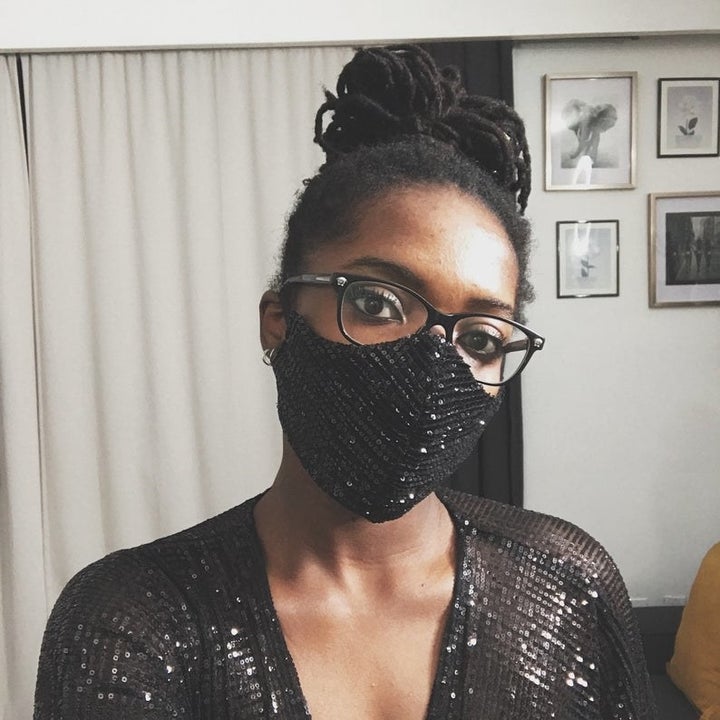 A person wears a sparkly face mask that covers their mouth and nose
