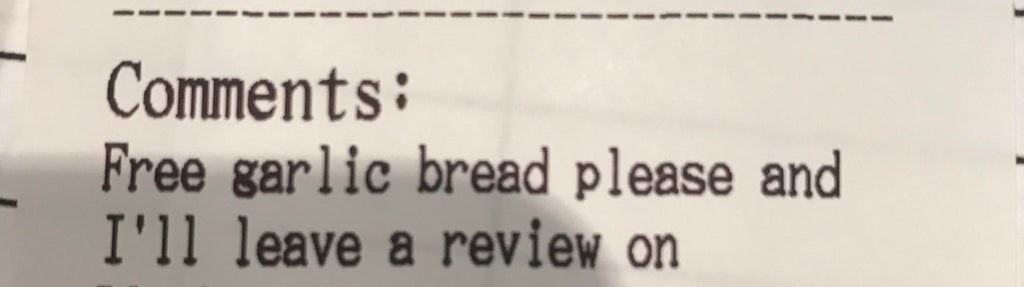 Someone asks a restaurant for free garlic bread in exchange for a review