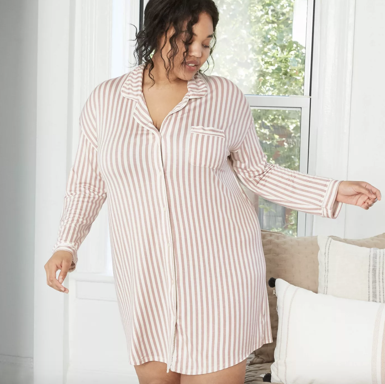 model wearing white and pink striped nightgown 