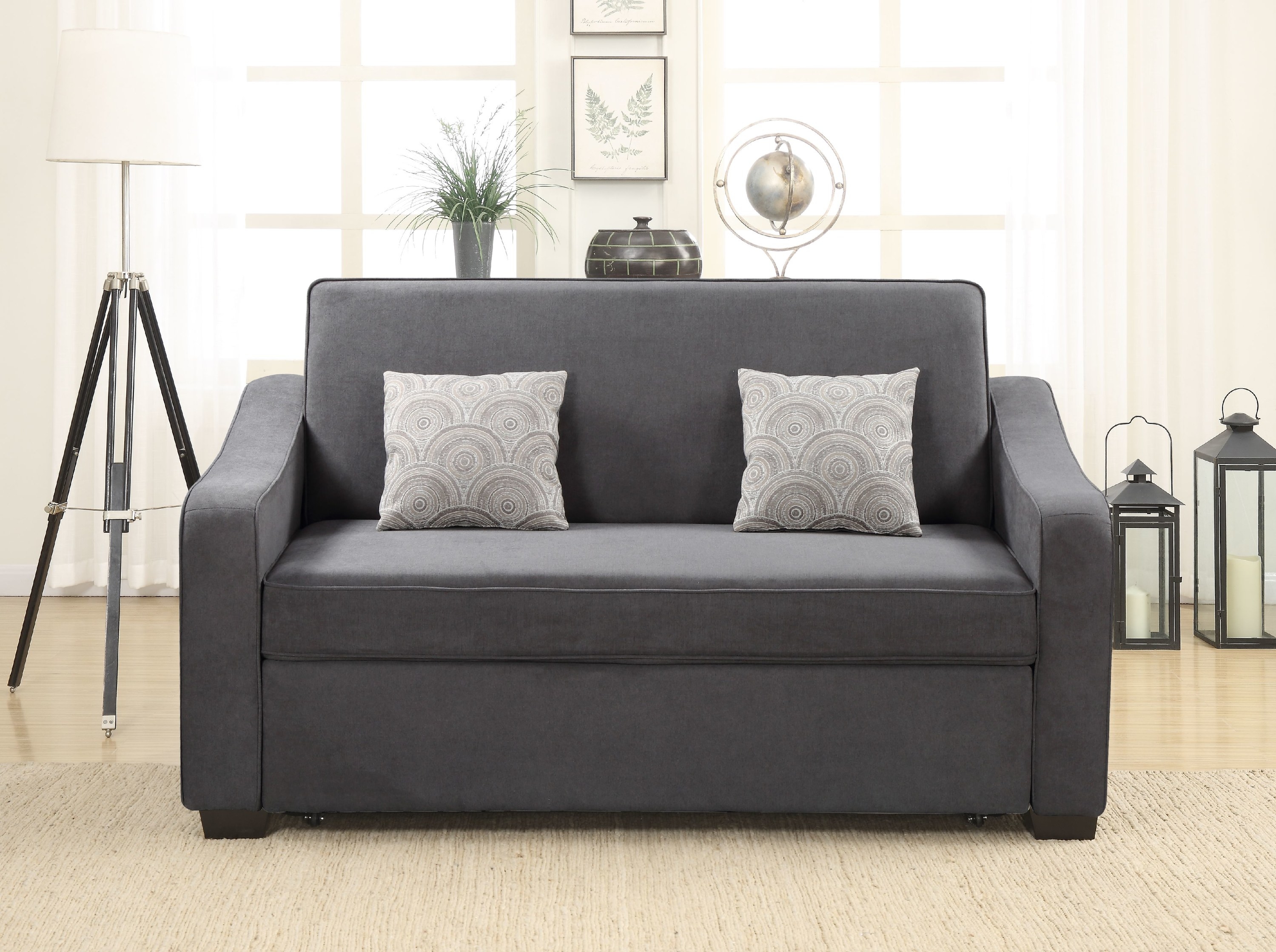 The compact gray sofa that can seat about two people