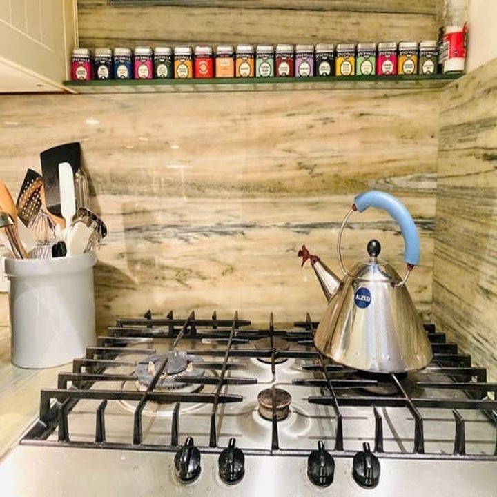 The tins on the shelf above Hannah's stove
