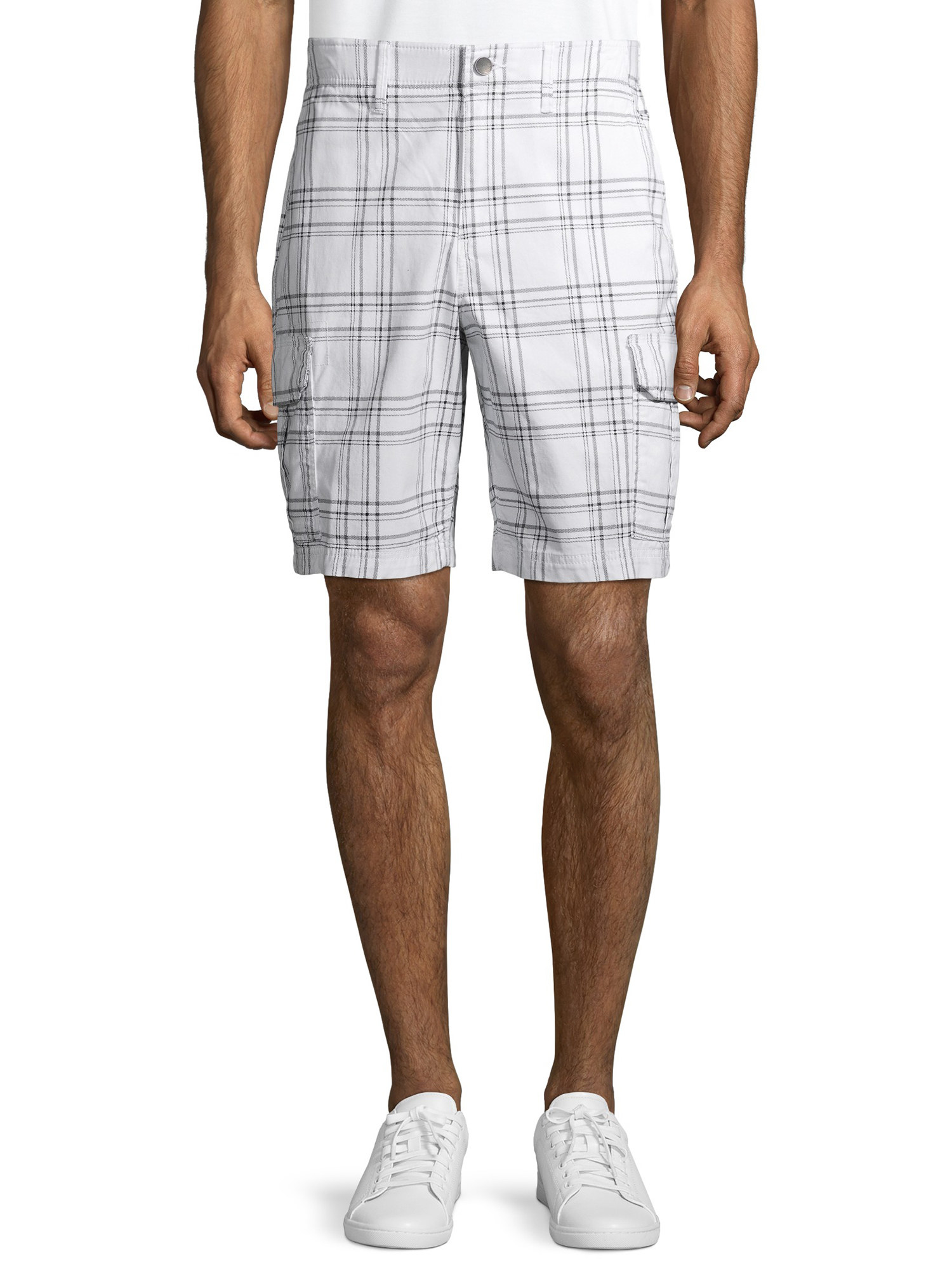 A model wearing the white and gray plaid shorts