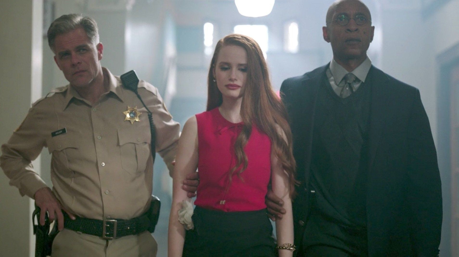 Cheryl being led away by the principal and Sheriff Keller