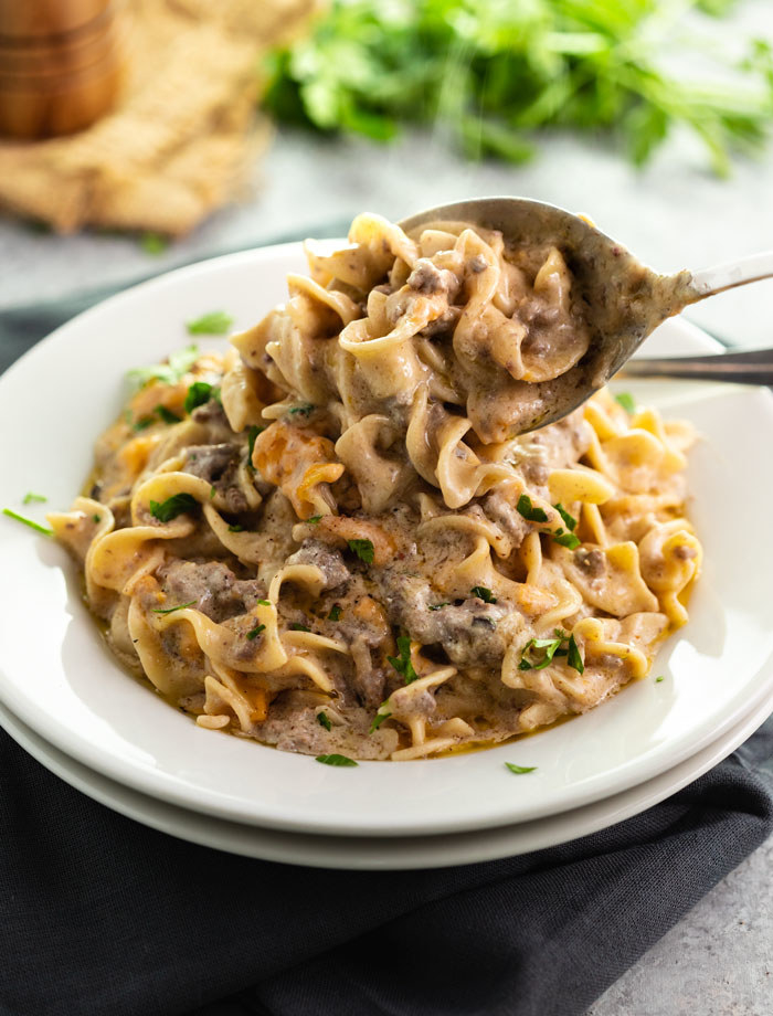 Plate of beef stroganoff garnished with parsley 