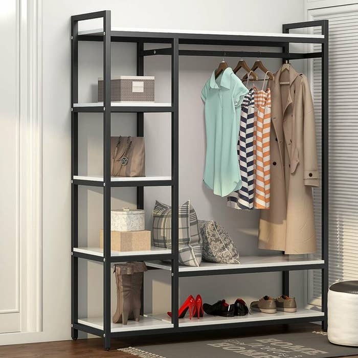 The closet system displaying clothes and shoes